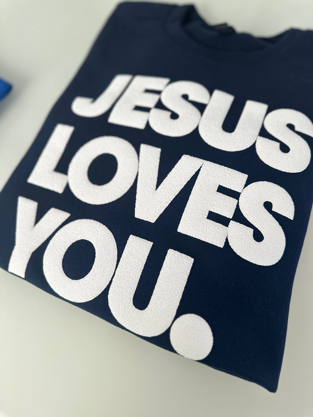 JESUS LOVES YOU.  white letters sweatshirt