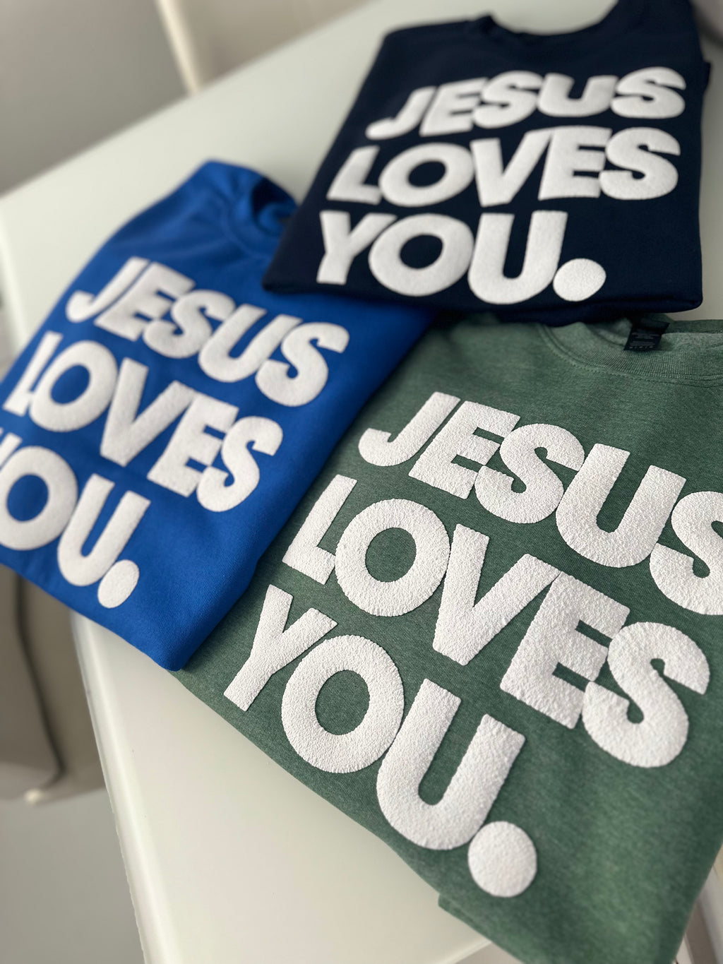 JESUS LOVES YOU.  white letters sweatshirt