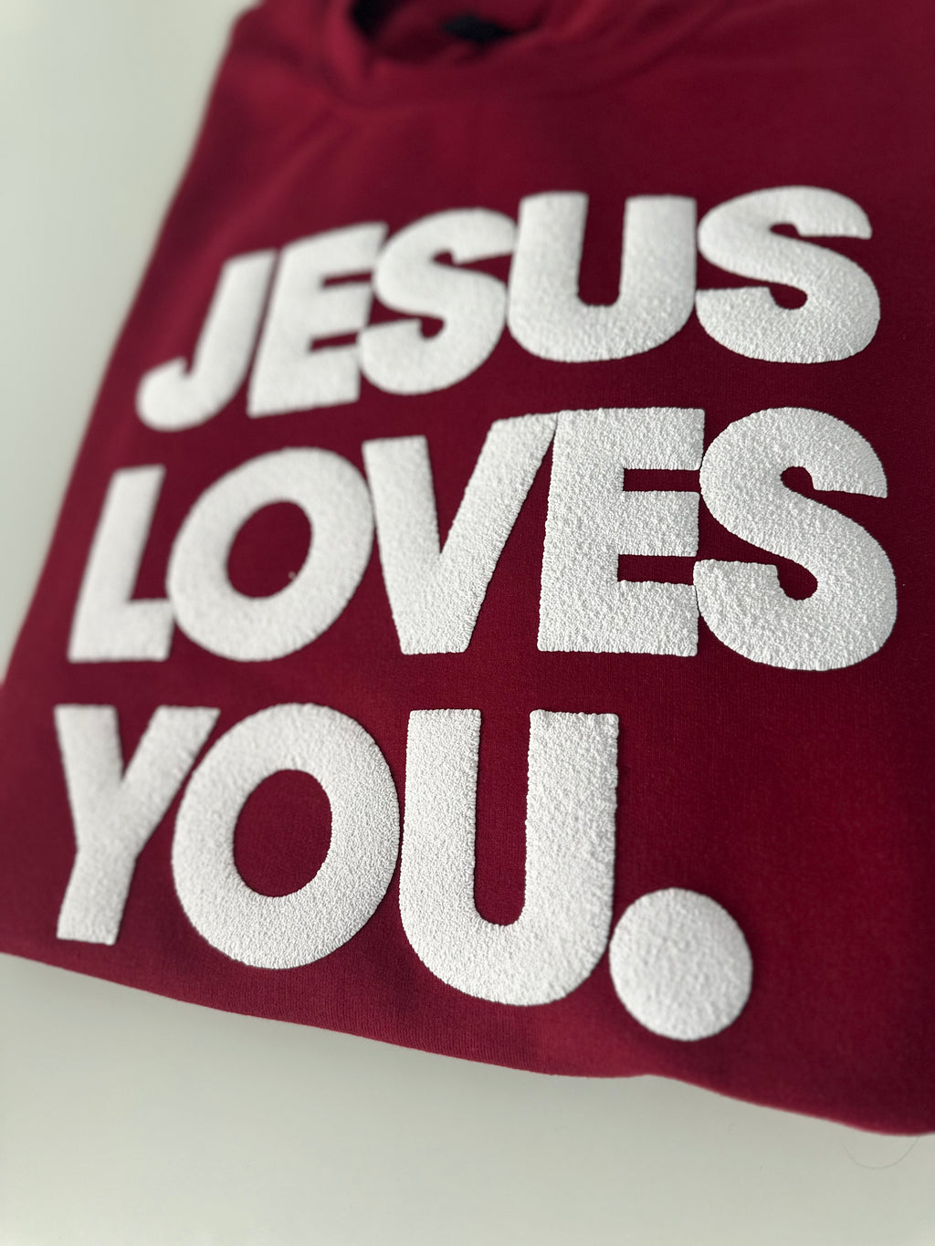 JESUS LOVES YOU.  white letters sweatshirt
